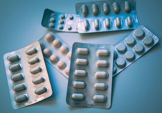 Blister packs with pills for pet cancer treatment and alternative therapies.